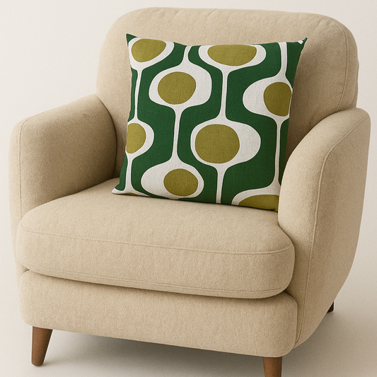 Beige armchair with a green and white patterned pillow on a beige background