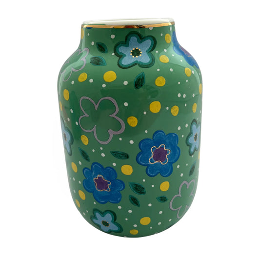 Green vase with floral patterns on a white background