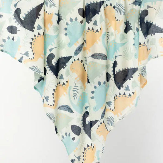 Indus Design Dinosaur Baby Swaddle - Cotton in Natural, Indigo, and Duck Egg."