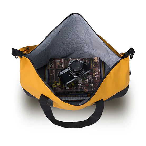 Yellow bag with a camera inside on a white background