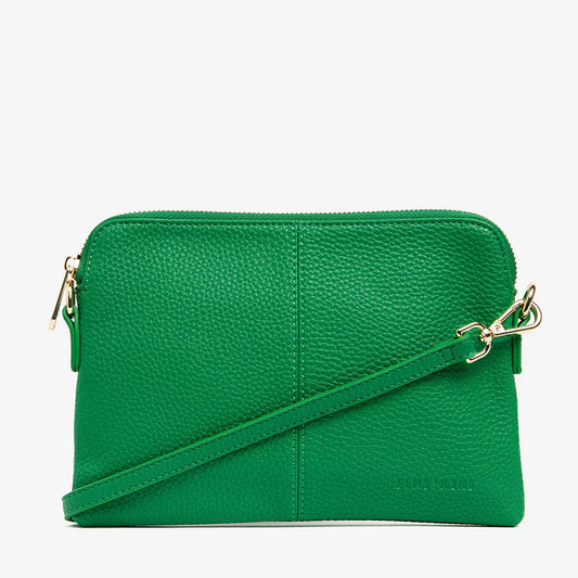 Green handbag with a gold chain strap on a white background