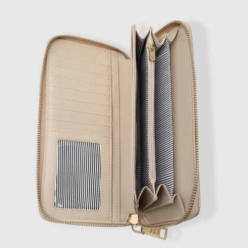 Beige travel wallet with zipper on a light gray background