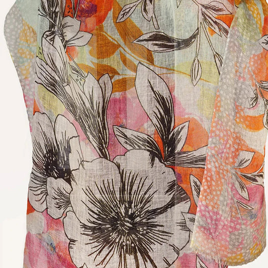 Soft Linen Scarf by Tradition Textiles - Black Floral Design on Orange, Pink, and White Background."