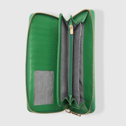 Green wallet with striped lining on a light gray background