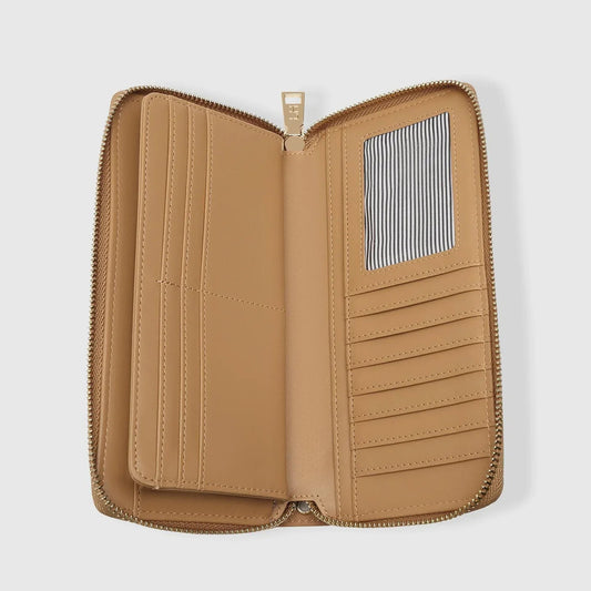 Tan leather wallet with zipper on a light gray background