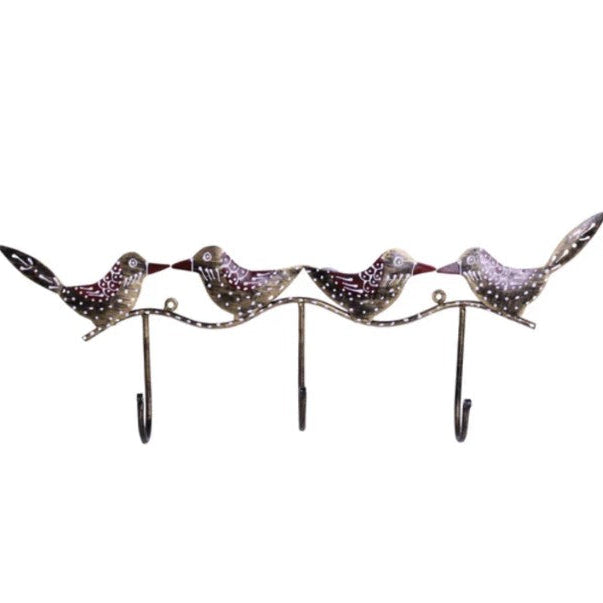 Decorative metal wall hook with four bird designs on a white background