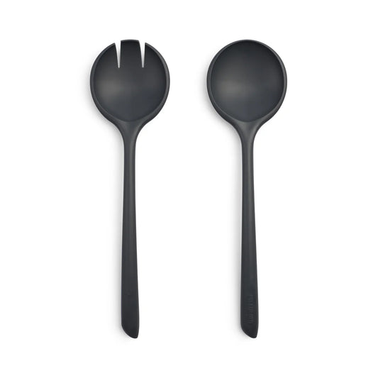 Two black salad servers on a white background