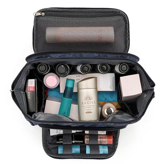 Open toiletry bag with various skincare products inside on a white background