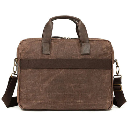 Brown canvas briefcase with shoulder strap on a white background - rear view.