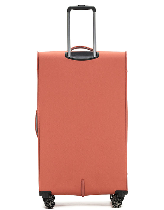 A large orange Vega luggage case with wheels and an extended handle.