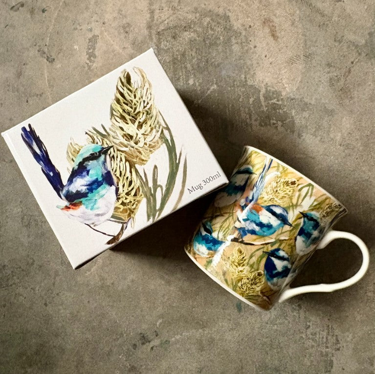 Mug and box with bird and nature design on a textured surface