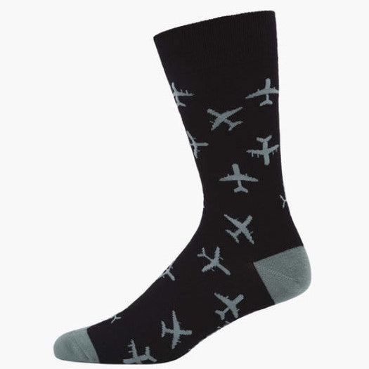 A single crew sock in black with a pattern of light gray airplanes, featuring a gray toe and heel, shown against a plain white background.