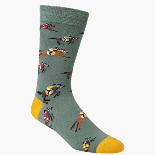 Sock with horse and jockey pattern on a green background
