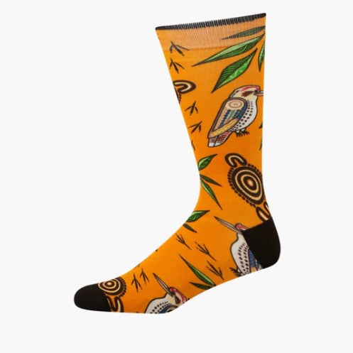 Orange sock with bird and leaf pattern on a white background