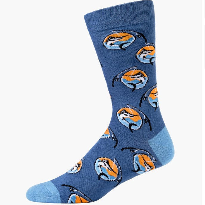 A single crew sock in medium blue with a repeating pattern of cartoon fish in orange, light blue, and white, shown on a plain light gray background.