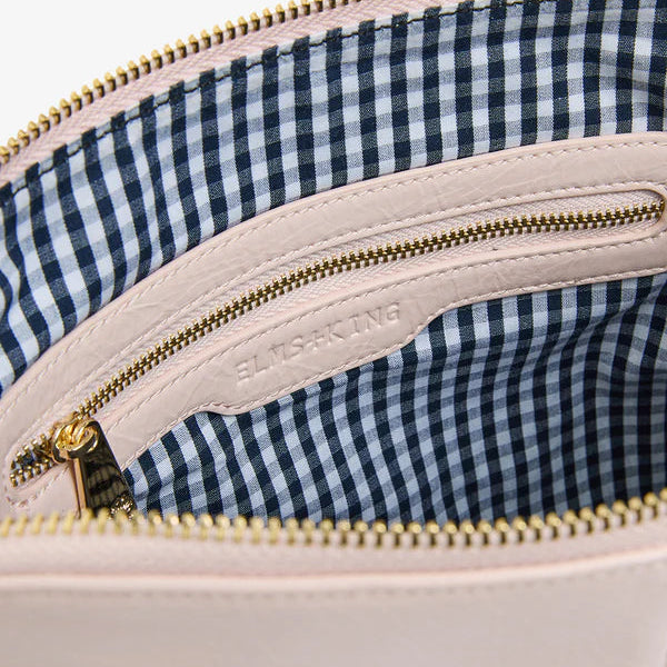 Interior of Burbank Crossbody Large with signature navy and white gingham lining.