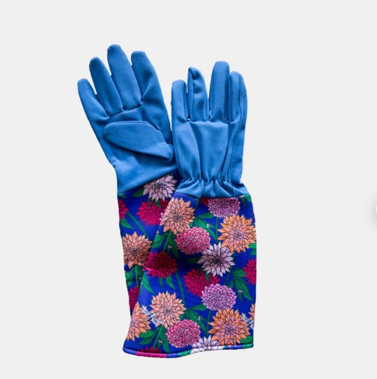 Pair of blue gardening gloves with colorful floral pattern on a white background