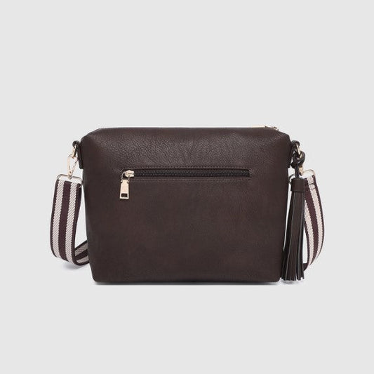 Brown handbag with a striped strap on a light gray background
