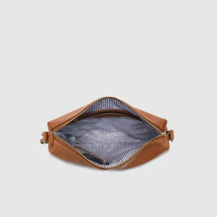 Brown handbag interior on a light gray background