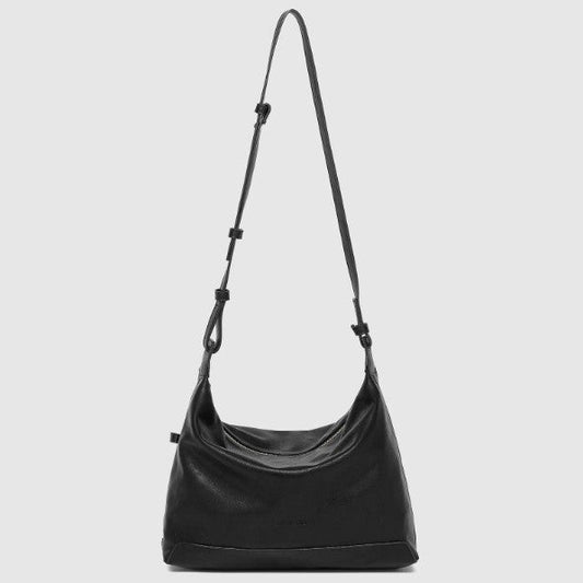 Black shoulder bag on a light gray background