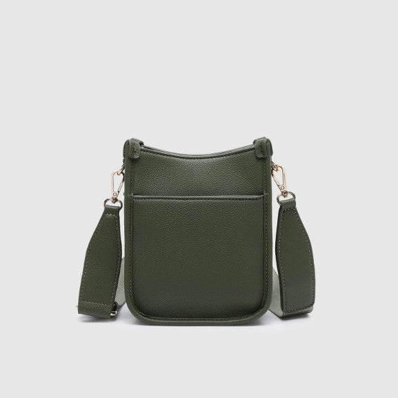 Green crossbody bag on a light gray background