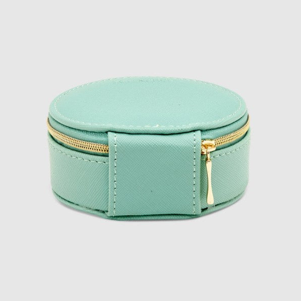 Mint green jewelry box with gold zipper on a light gray background