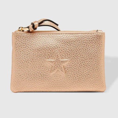 Rose gold wallet with star design on a light gray background