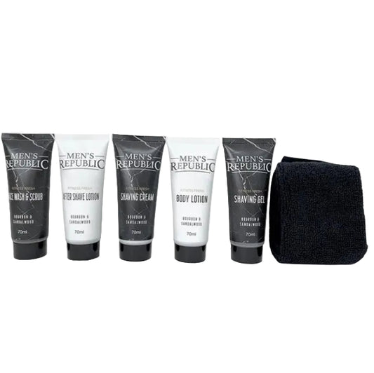 Men's grooming kit by Men's Republic featuring five 70ml tubes of shaving products in black and white packaging, alongside a black microfiber towel, arranged on a plain white background.