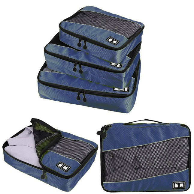 Set of blue packing cubes with black zippers on a white background