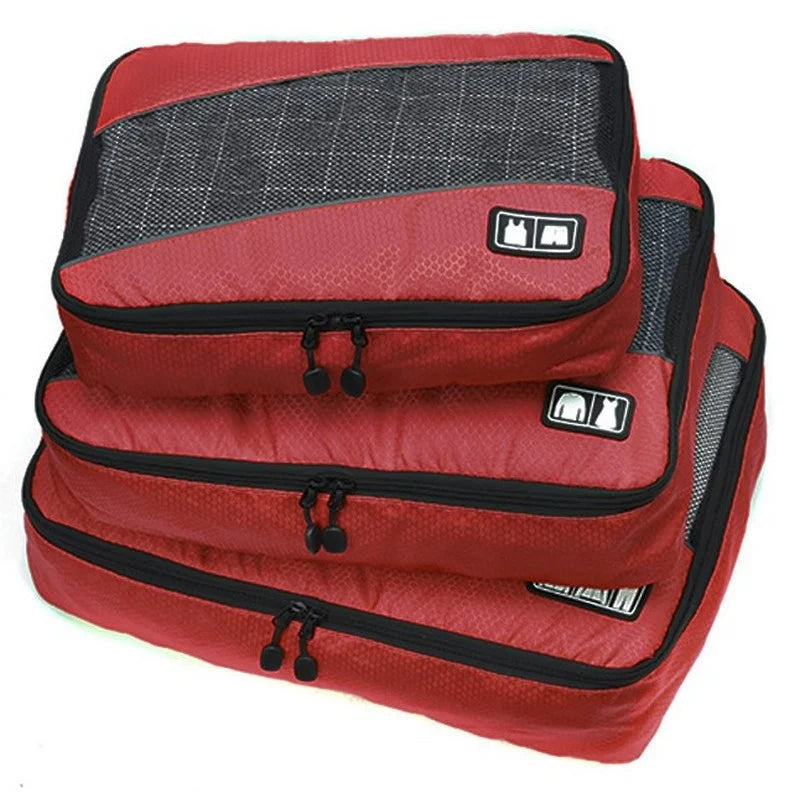 Red packing cubes with black zippers on a white background