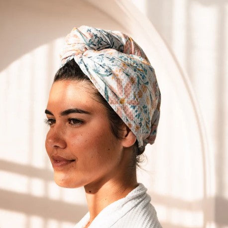 Woman wearing a quick dry hair wrap with a soft light background