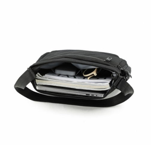 Black shoulder bag with compartments on a white background