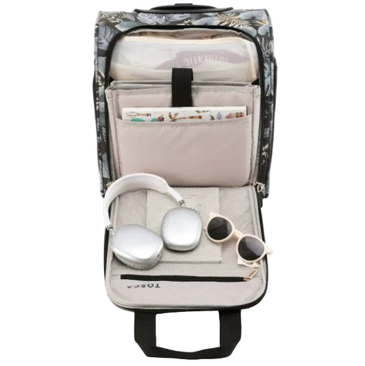 Backpack with compartments for headphones, sunglasses, and a book on a white background