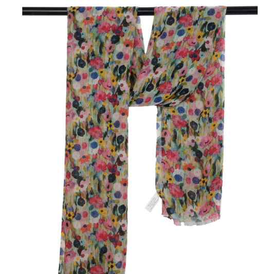 Floral patterned scarf on a black rod with a white background
