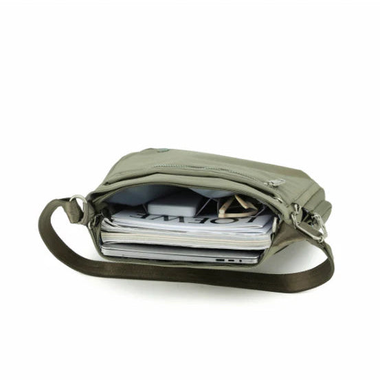 Green shoulder bag with a strap on a white background