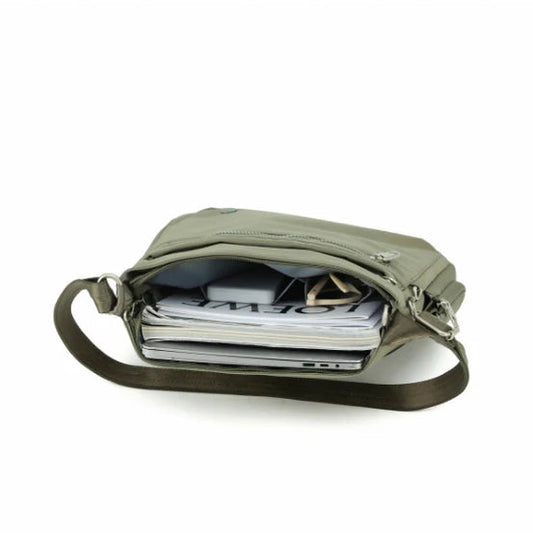 Green shoulder bag with a strap on a white background