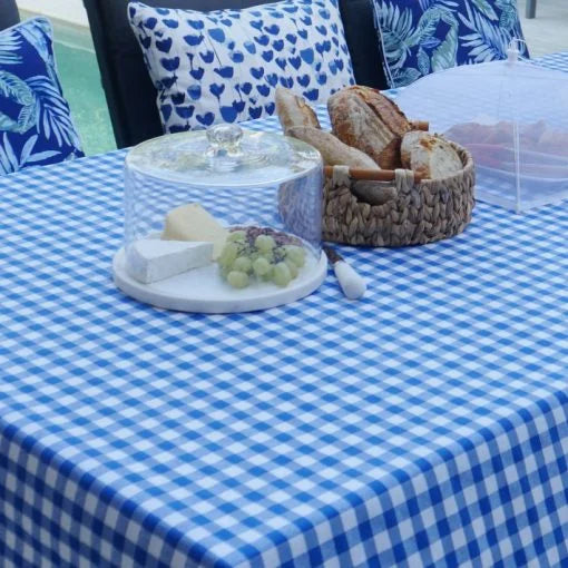 Elegant European fabric tablecloth with stain-resistant protective coating, easy to wipe clean.  Lifestyle in blue gingham. 150x300cm