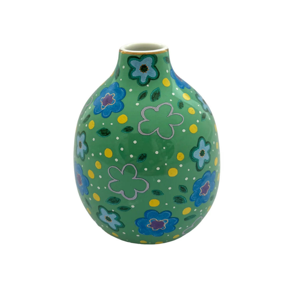 Green vase with floral patterns on a white background