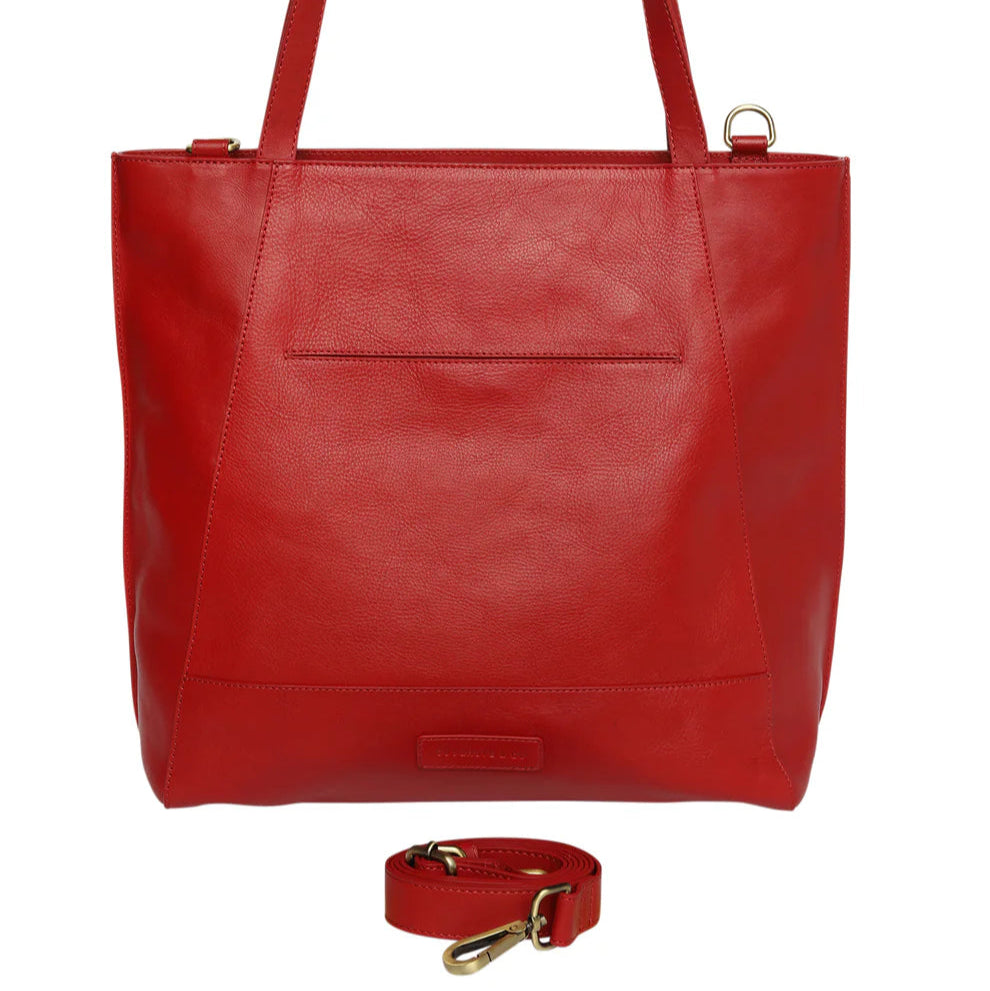 Red leather tote bag with a matching strap on a white background