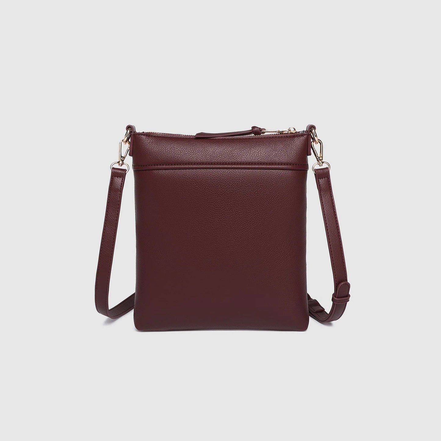 Structured burgundy crossbody satchel with adjustable shoulder strap and sleek detailing