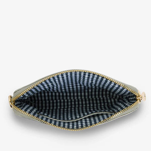 Pouch with blue and white checkered interior on a white background