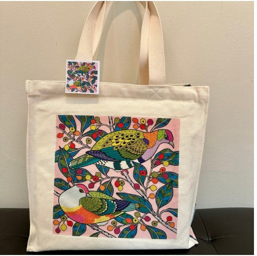 Tote bag with colorful bird design on a plain background