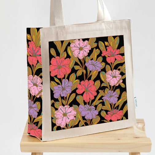 Tote bag with floral design on a black background