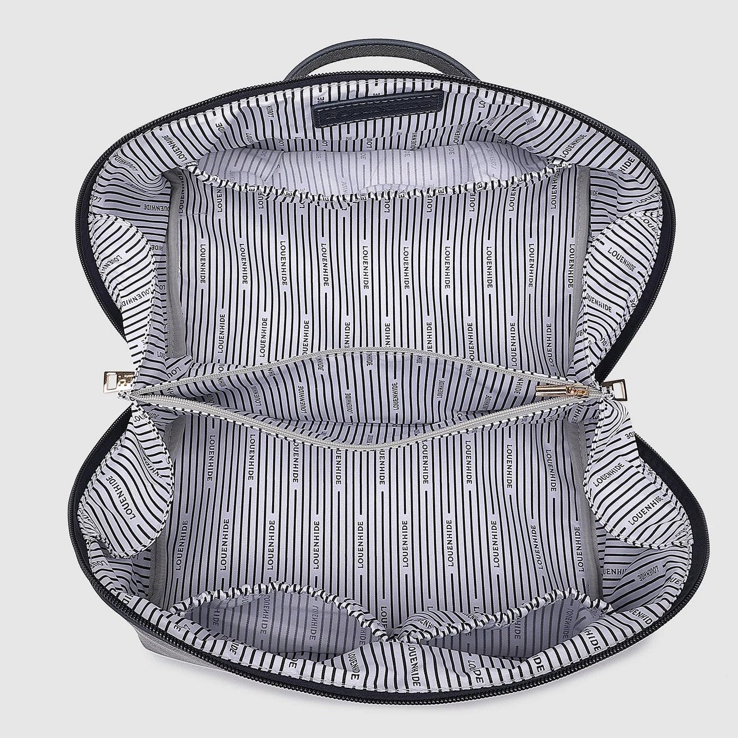 Open navy toiletry bag with striped interior on a light gray background