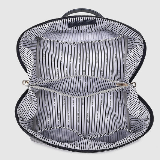 Open navy toiletry bag with striped interior on a light gray background