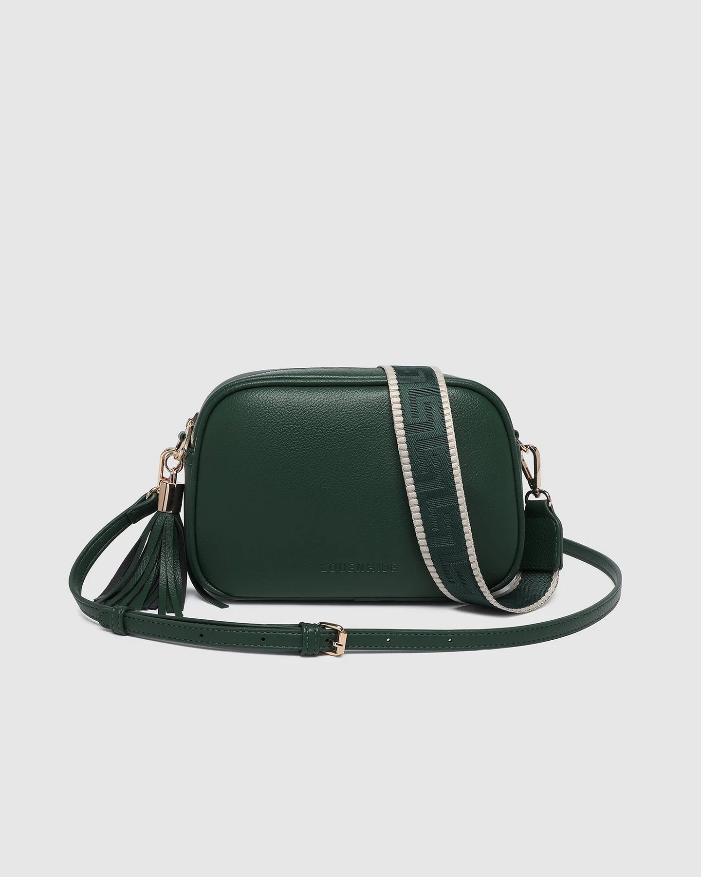 Green leather crossbody bag on a light gray background