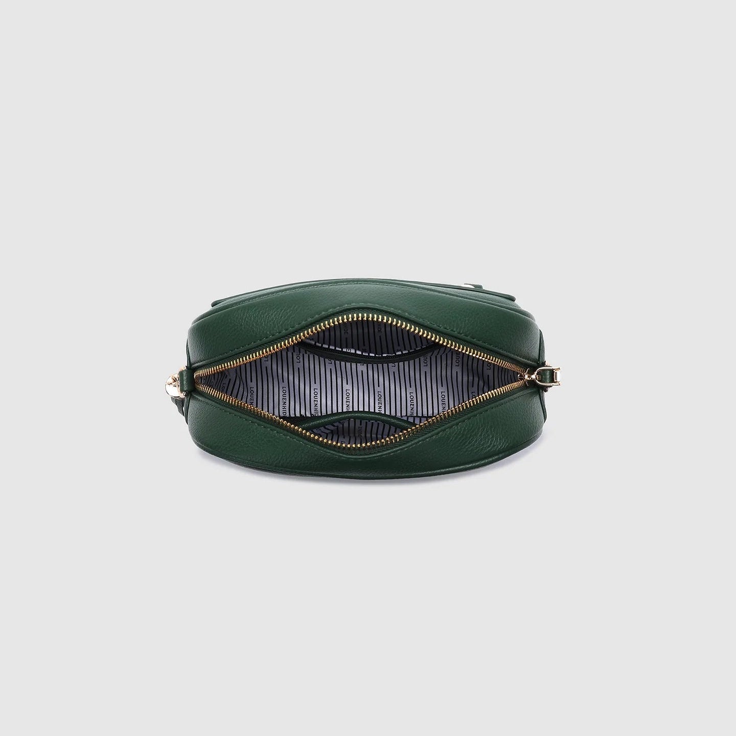 Green handbag with gold zipper on a light gray background