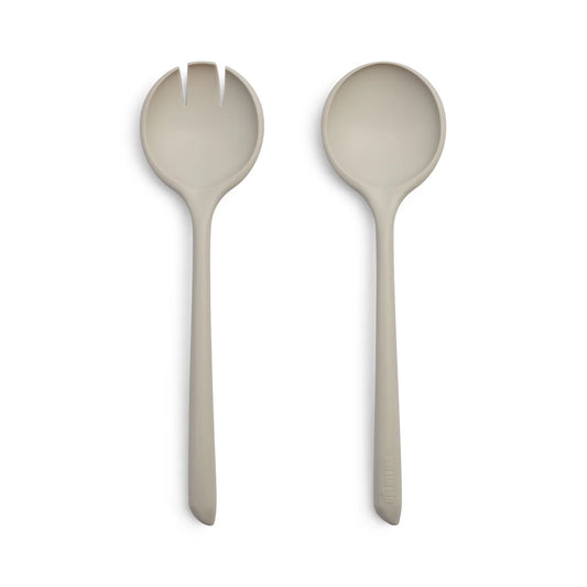 Two beige salad servers on a white background