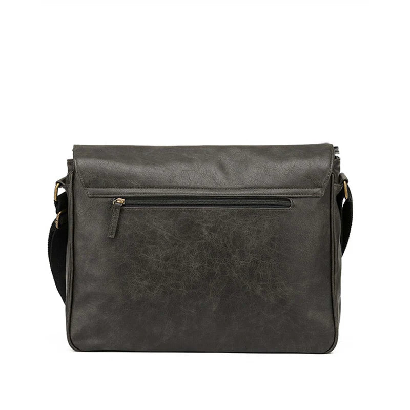 Dark gray leather messenger bag on a white background - rear view.