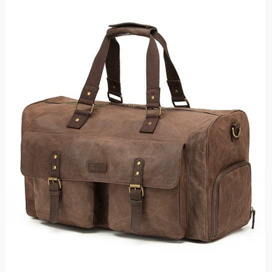 Brown leather duffel bag with gold accents on a white background
